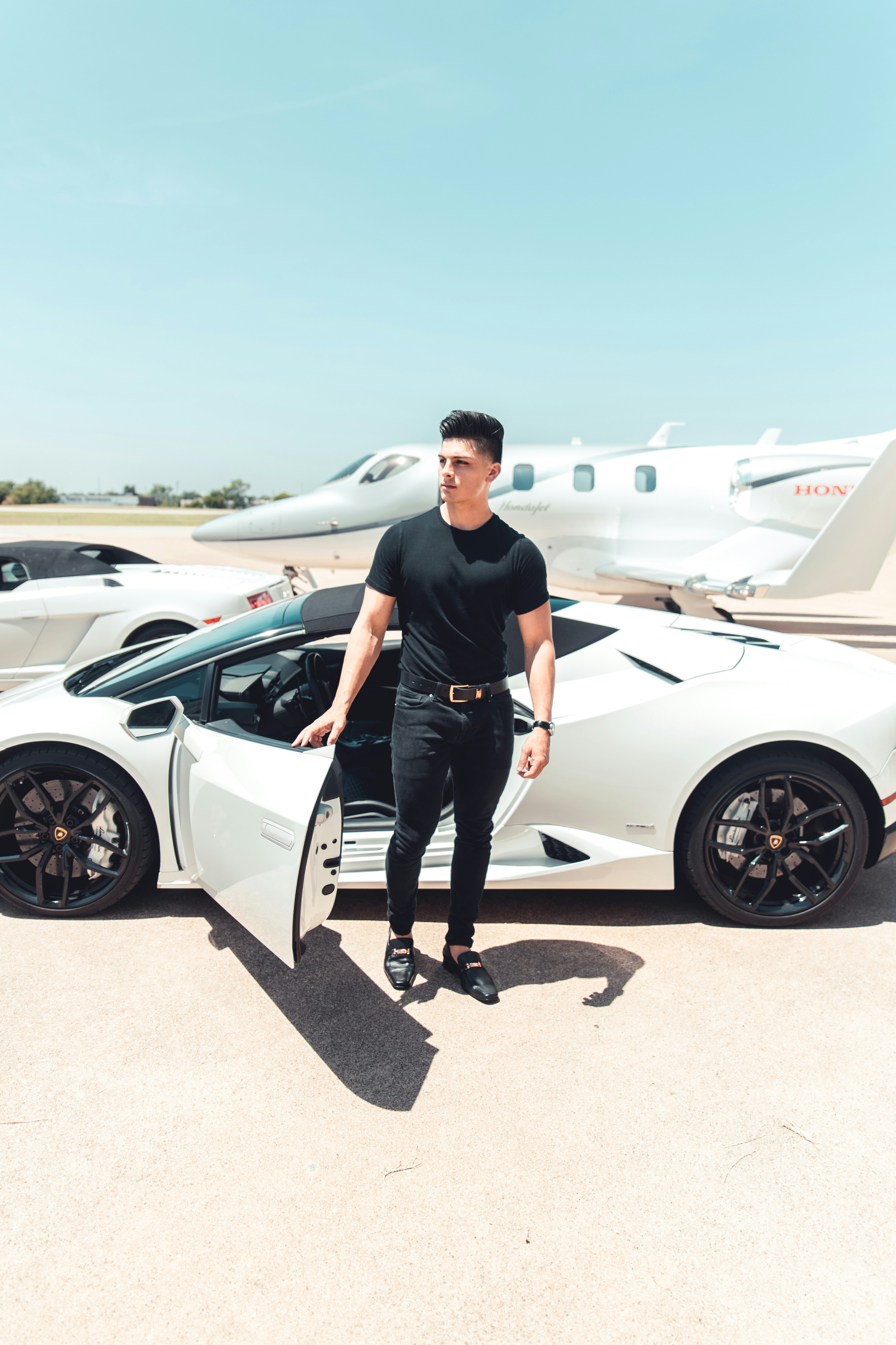 Man stepping out of a lamborghini